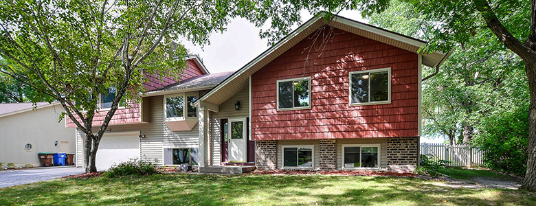 Budget Exteriors A red house.